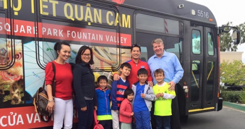 Tam Nguyen in front of bus